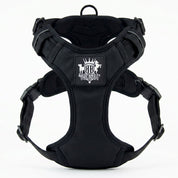 Black dog harness with a visible brand logo on a white background
